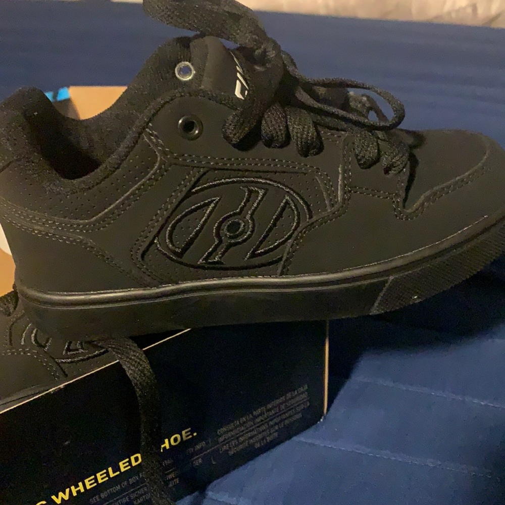 All black wheel on a shoe